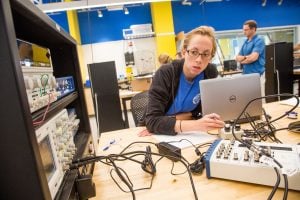 A Johns Hopkins engineering student tests out electrical components